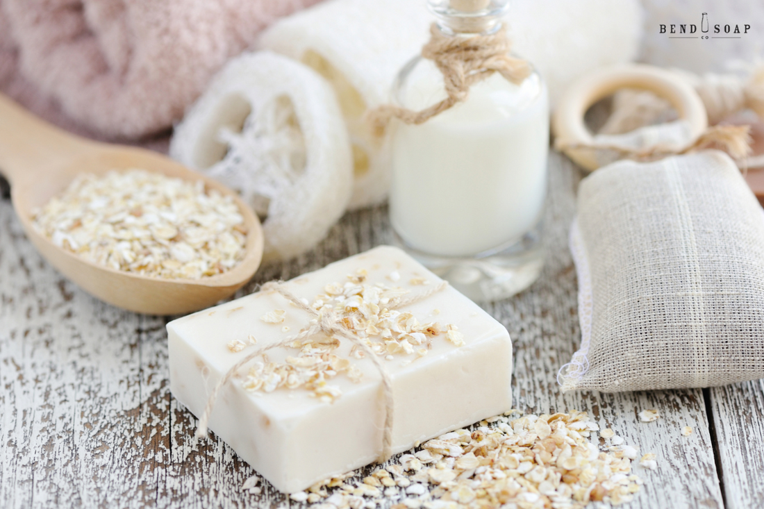 Goat milk soap for your face next to oats and goat milk