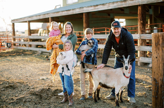 Founders of Bend Soap Co. on the farm with their nubian goats
