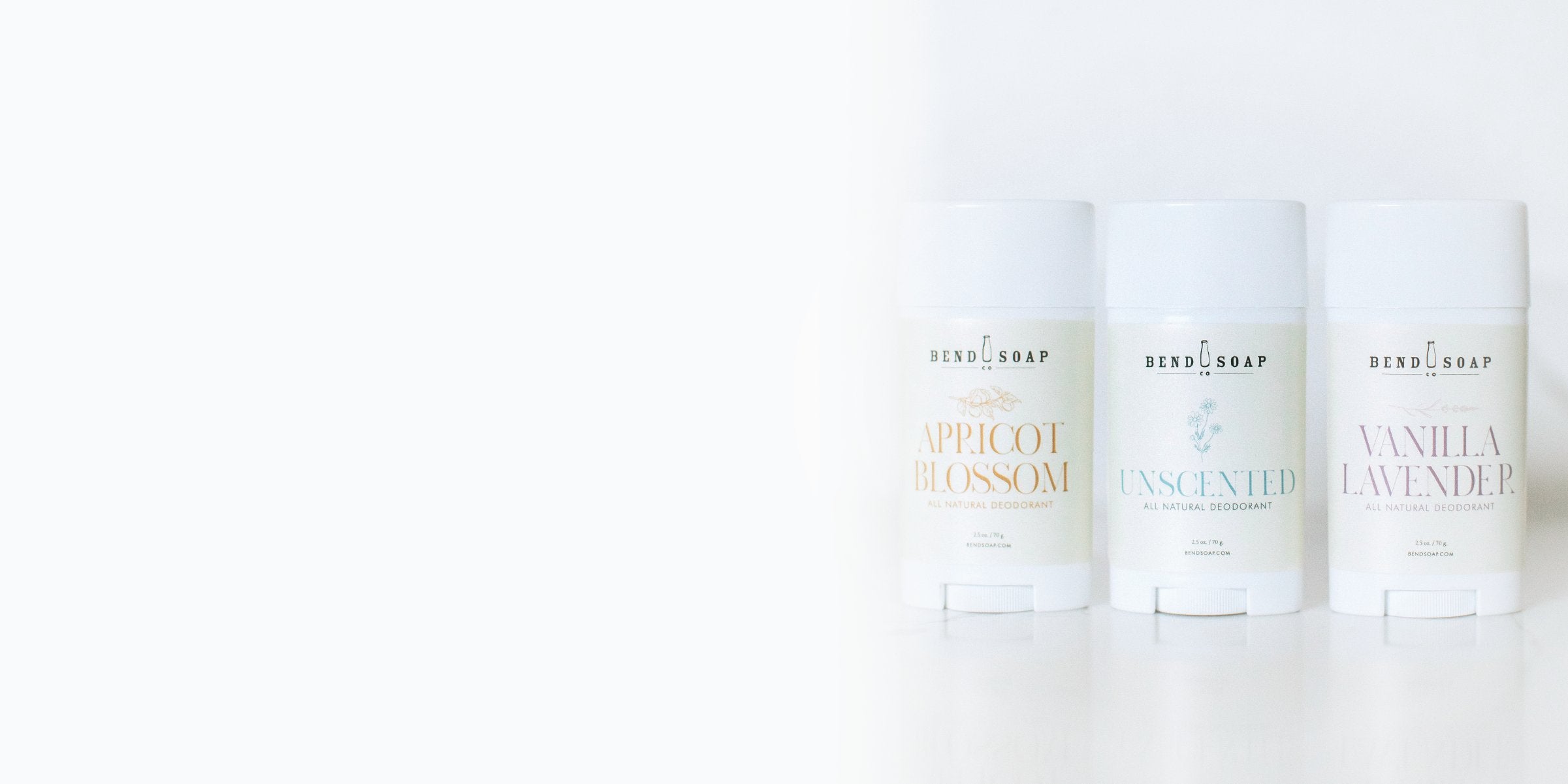 Three Bend Soap Co. natural deodorant sticks (Apricot Blossom, Unscented, Vanilla Lavender) lined up on white background, illustrating natural product options