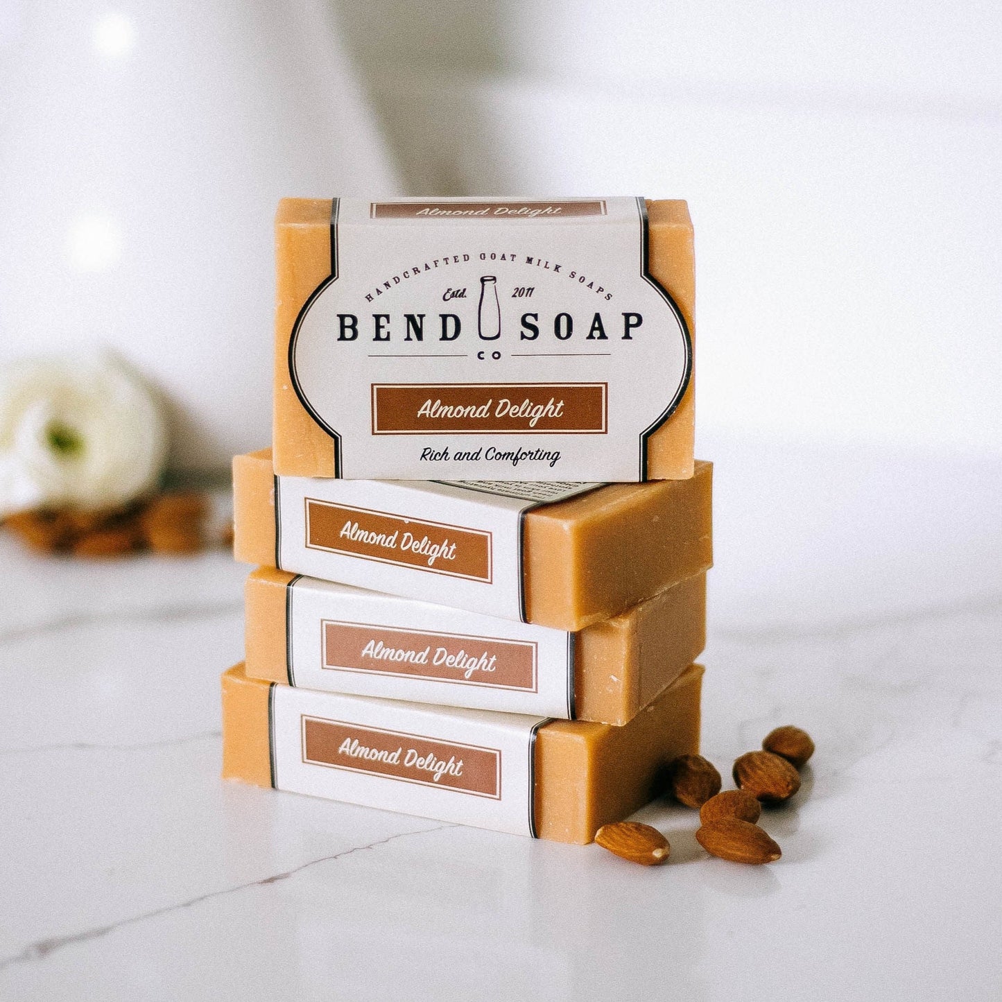 stack of almond delight goat milk soap bars
