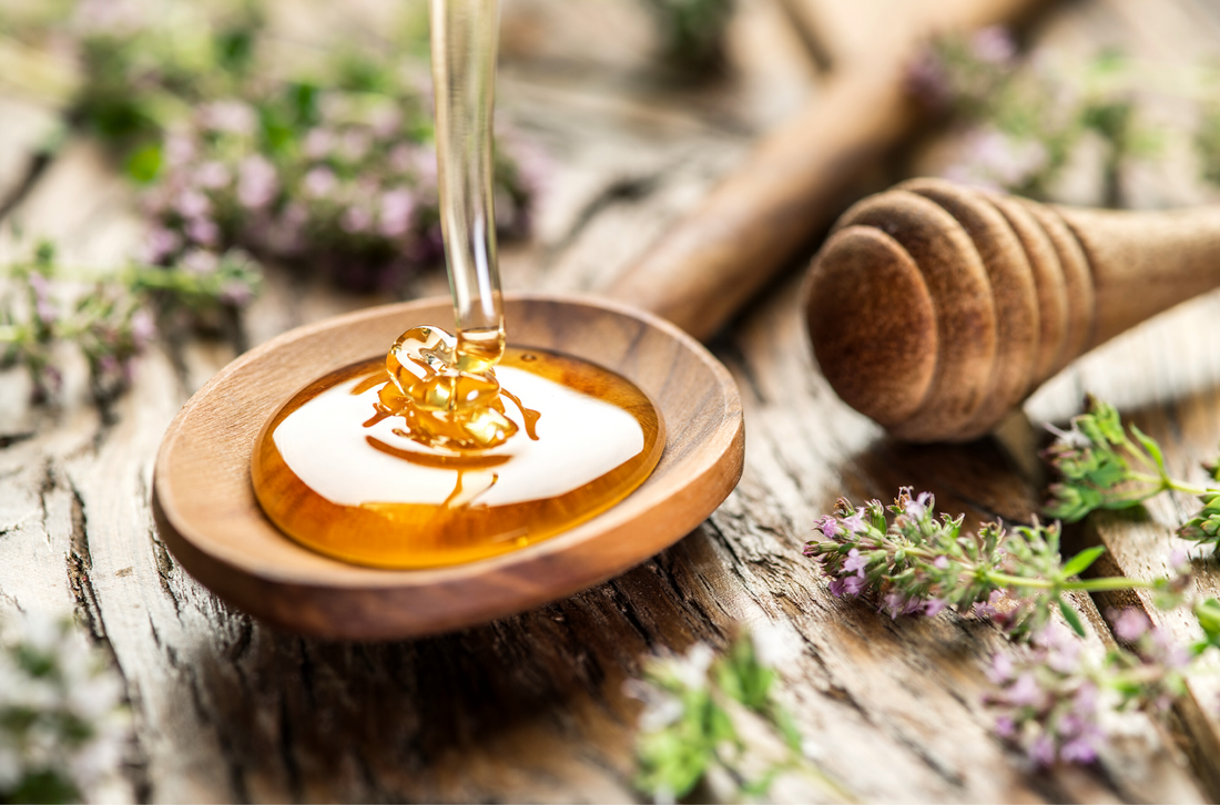spoonful of fresh honey on a natural background