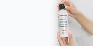 Sweet orange Goat Milk Lotion on White Bed Comforter