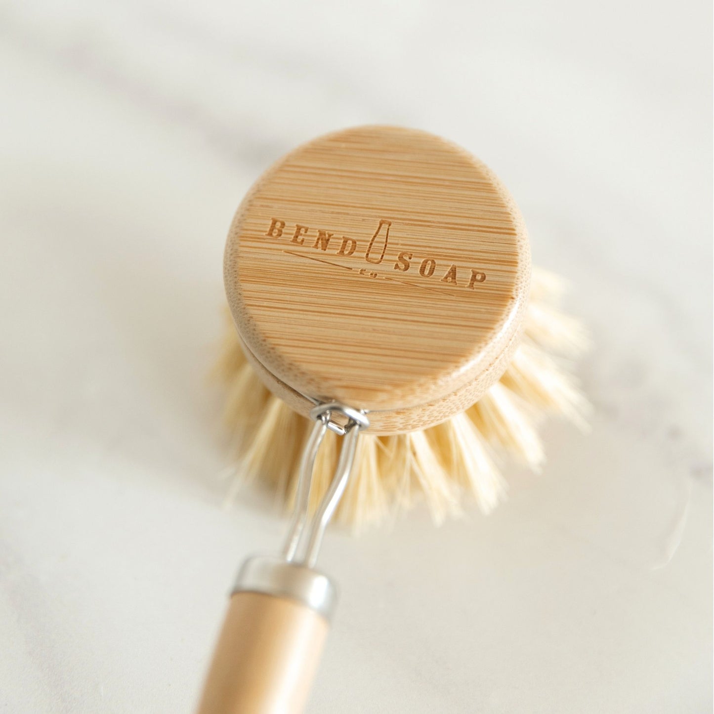 Long Handle Dish Brush with Bend Soap logo