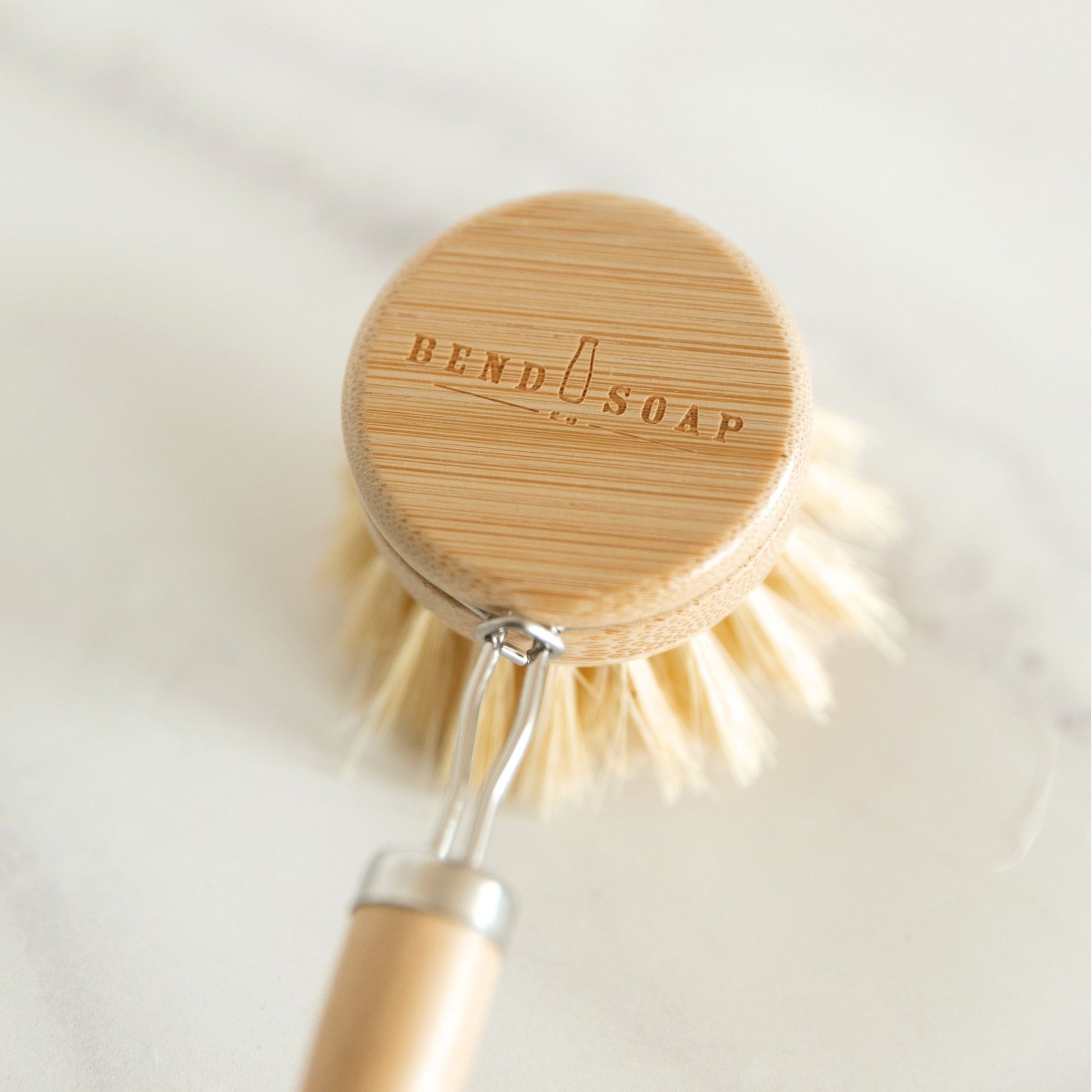 Long Handle Dish Brush with Bend Soap logo