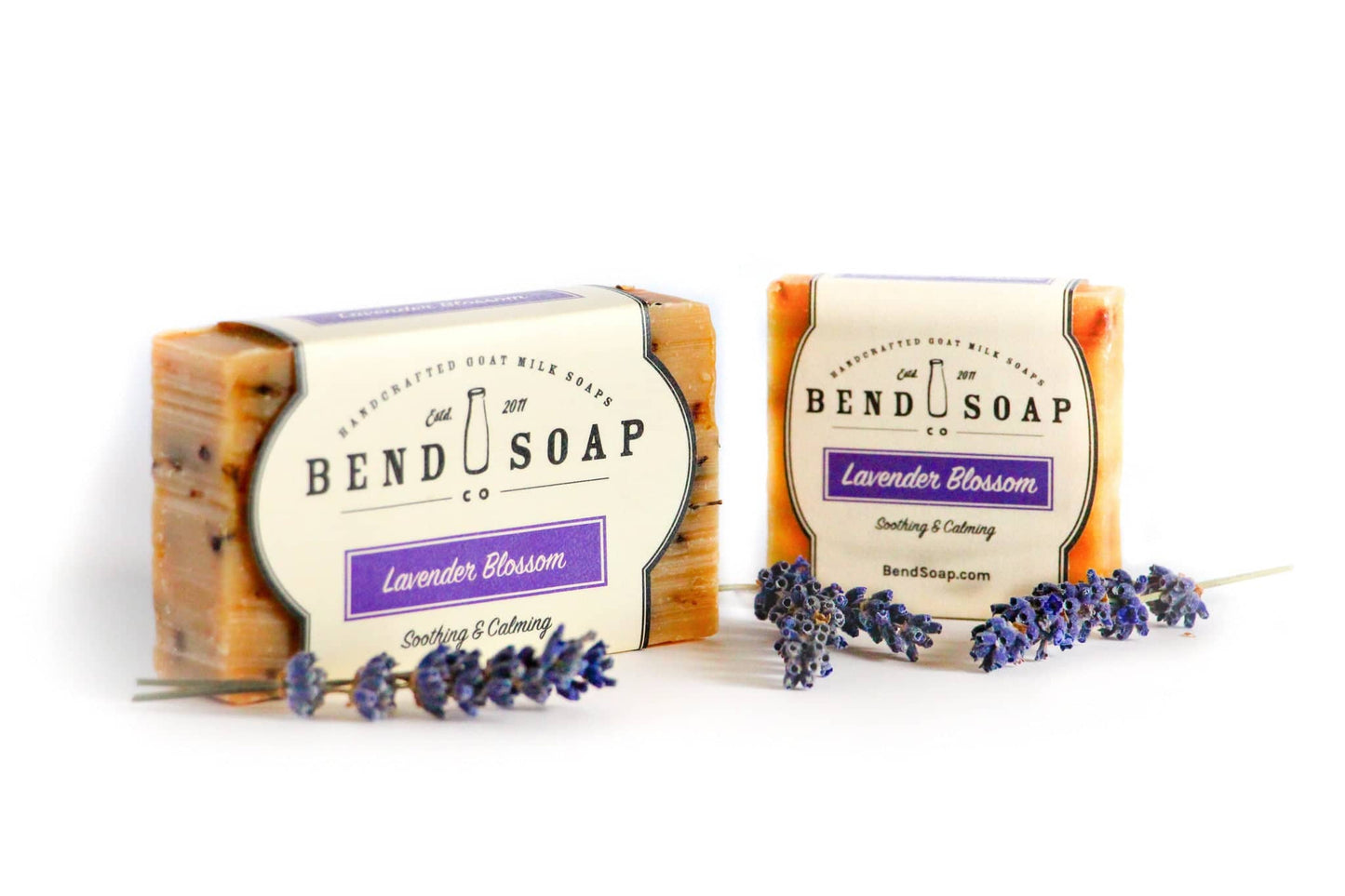 Full Size Lavender Blossom bar of soap and Travel Size bar of soap wrapped in Lavender Blossom labels.