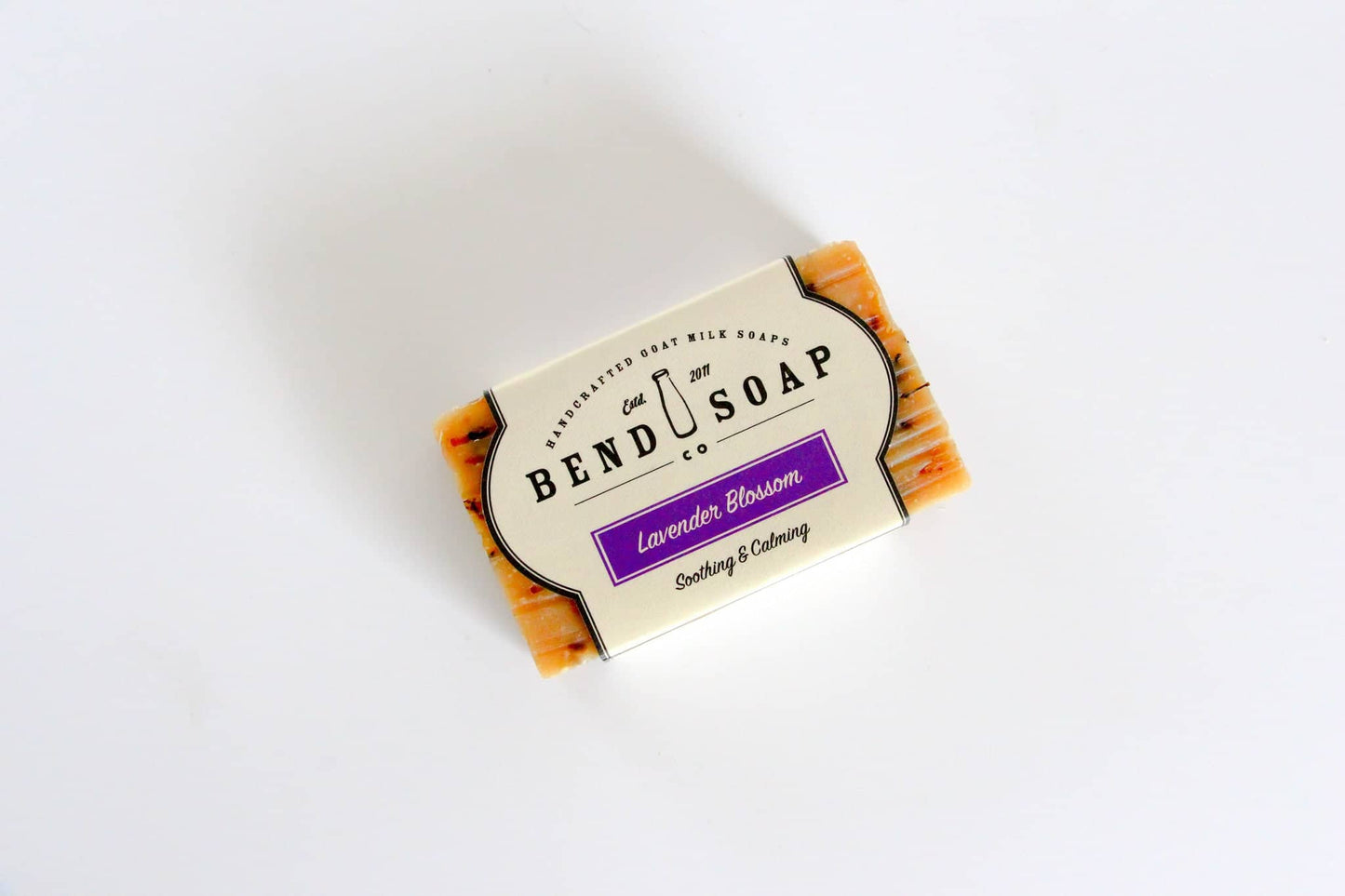 Full Size Lavender Blossom bar of soap wrapped in Lavender Blossom label on blank background